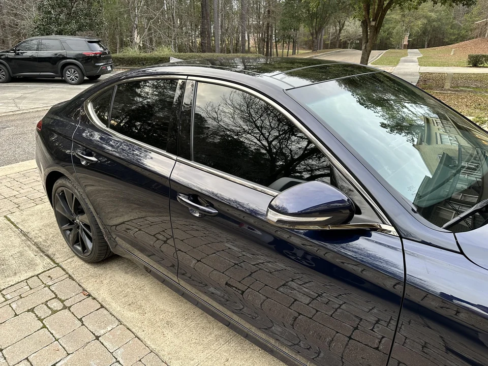 Dark sedan side windows showing 15% window tint