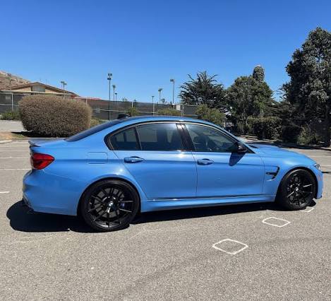 Blue BMW side windows showing 50% window tint